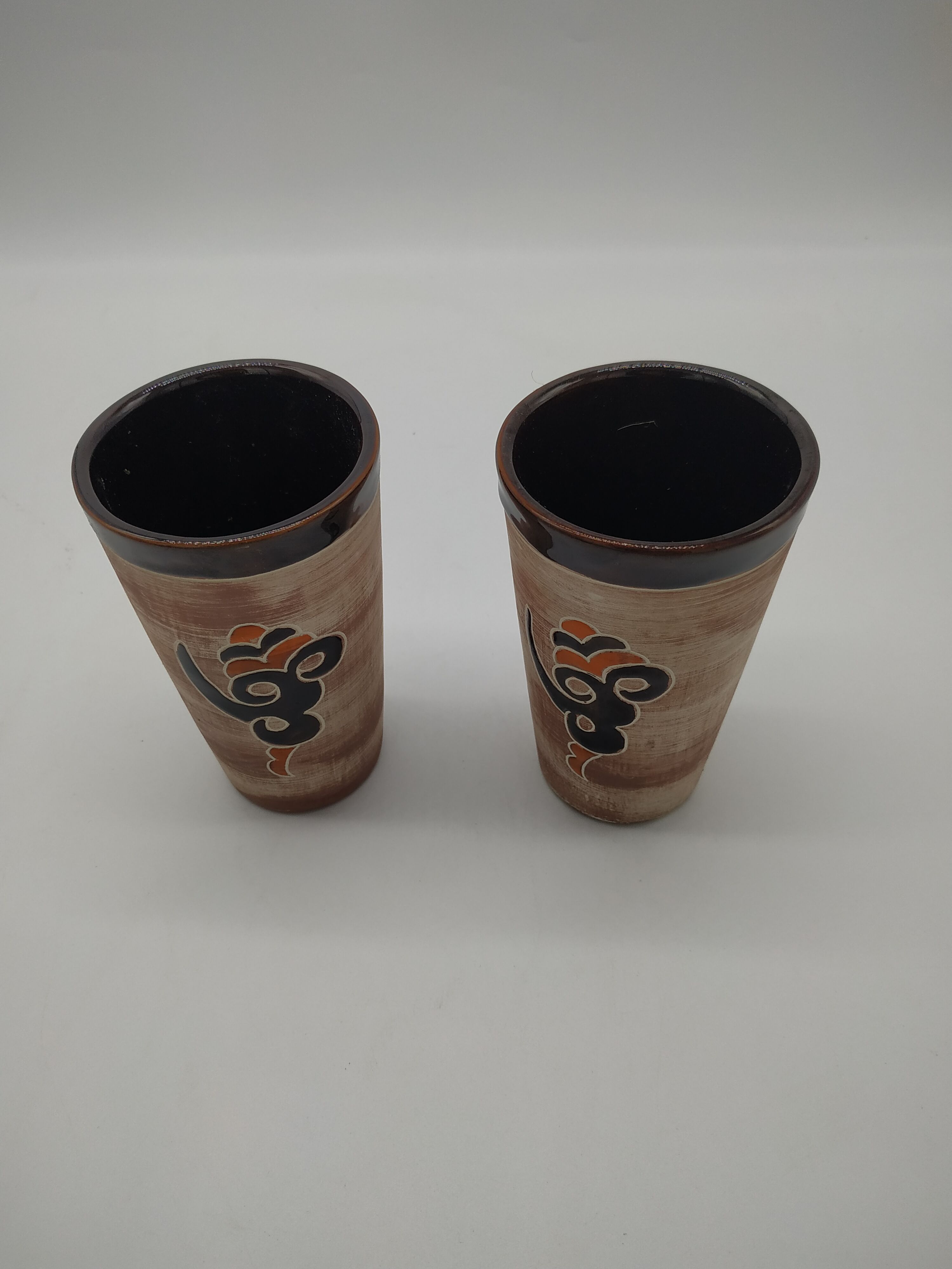 Pair of vintage enamelled terracotta mugs