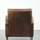 Sheepskin armchair in a light cognac colour with matching piping