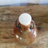 Old bottle of varnished sandstone