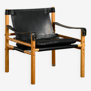 Arne norell sirocco safari lounge chair en cuir noir et frêne, suède