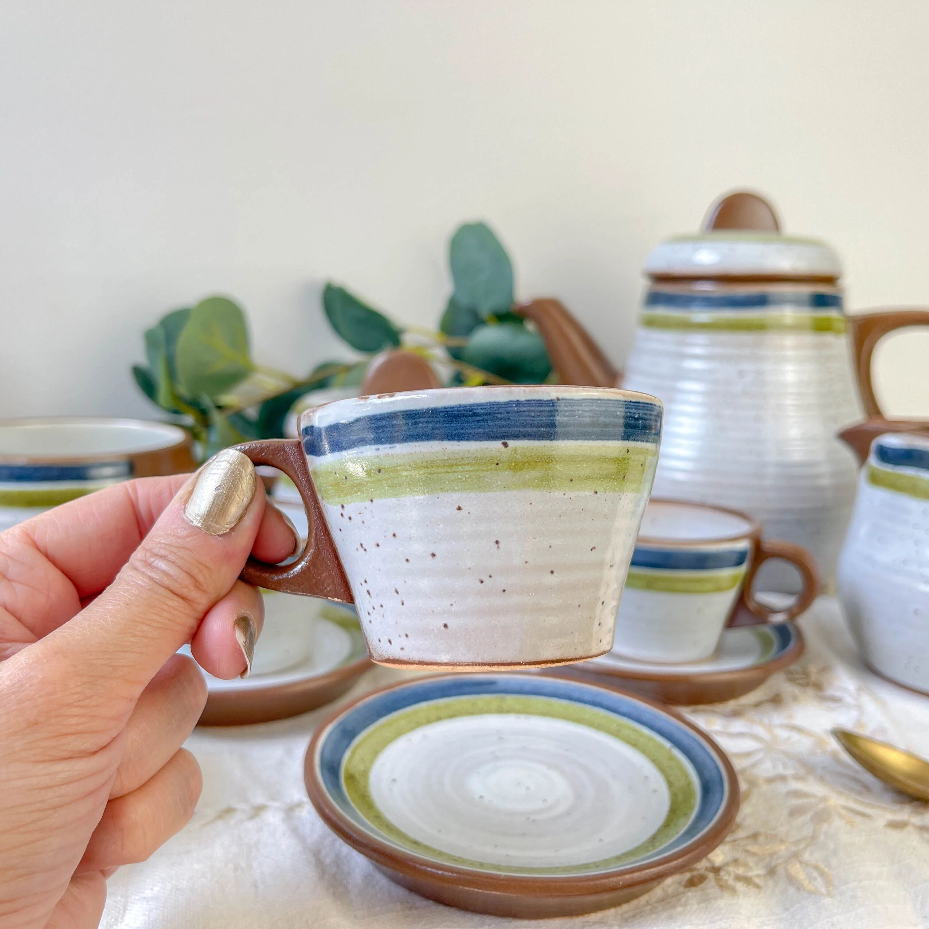 Vintage 1950s speckled stoneware coffee set with grey, green, and blue stripes