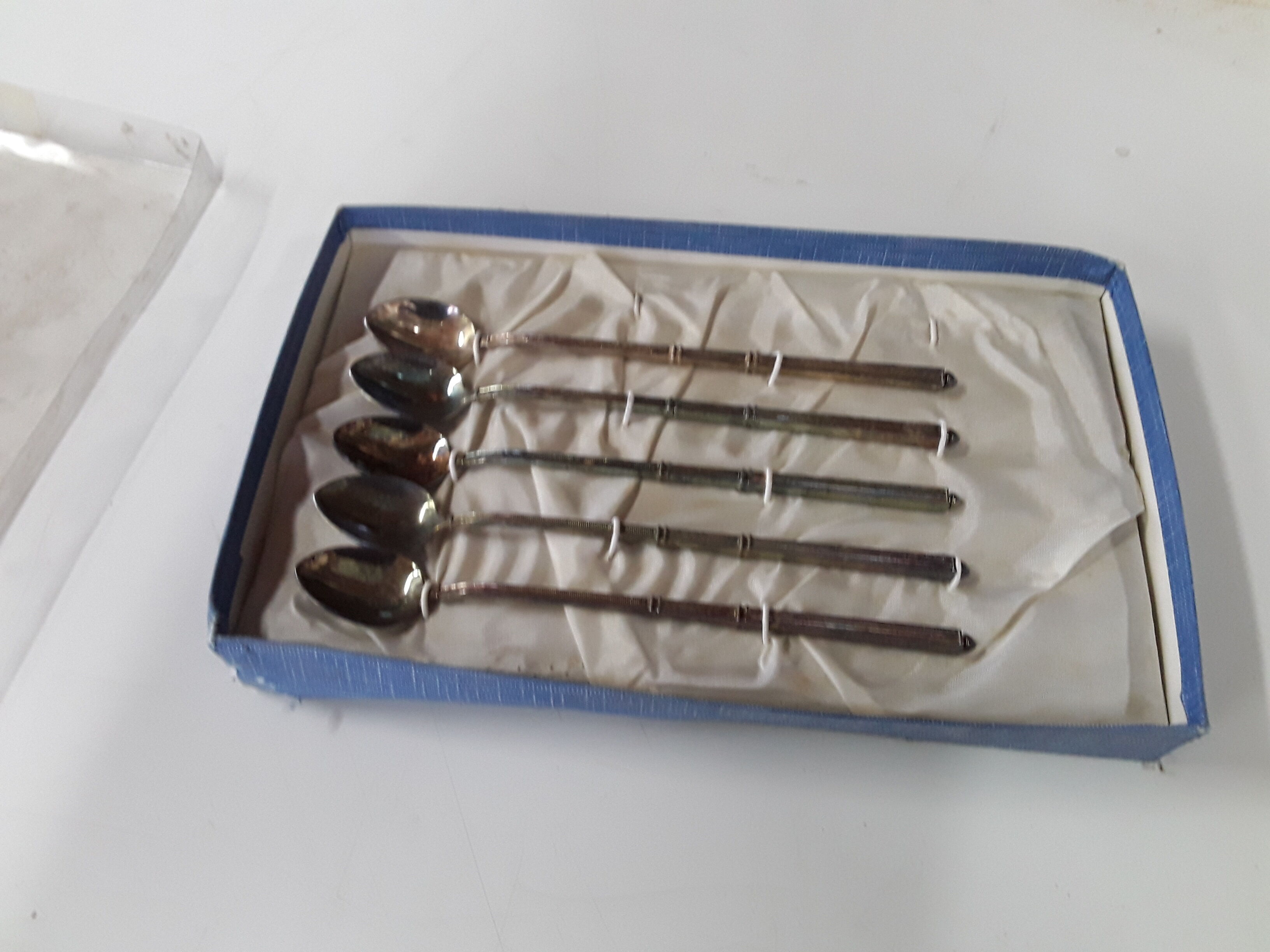 Old box with five spoons