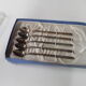 Old box with five spoons