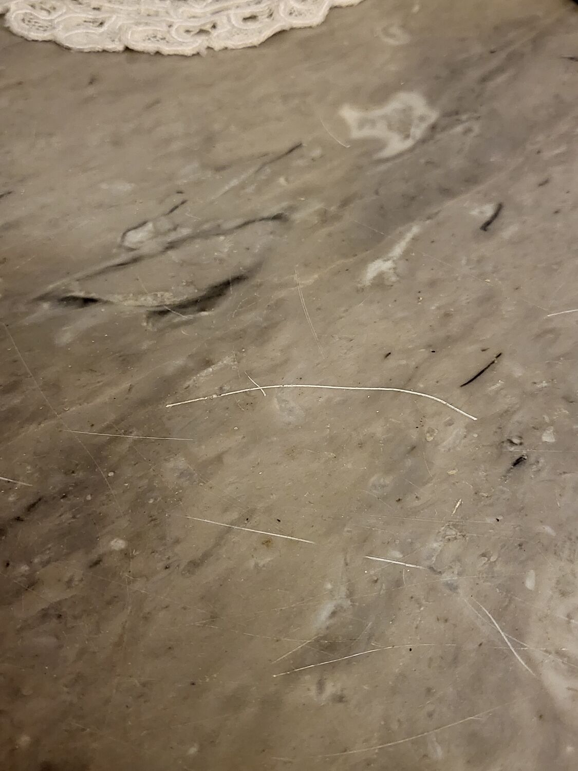 Pedestal table above marble