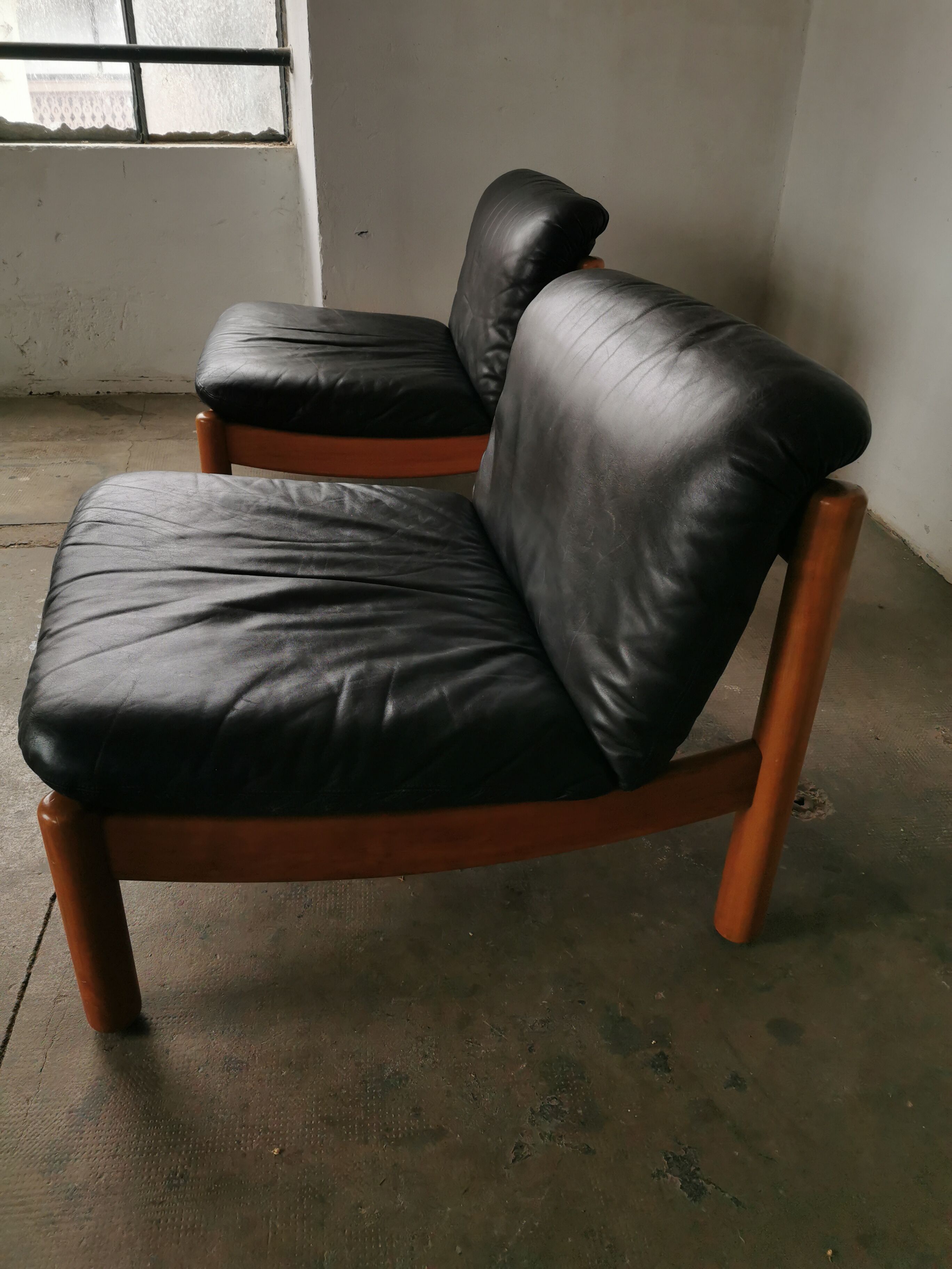 Pair of designer leather armchairs 80s