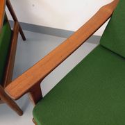 Pair of vintage Scandinavian armchairs in teak and green fabric from the 1960s.