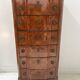 Transitional style chest of drawers in rosewood and amaranth veneer, 20th century.