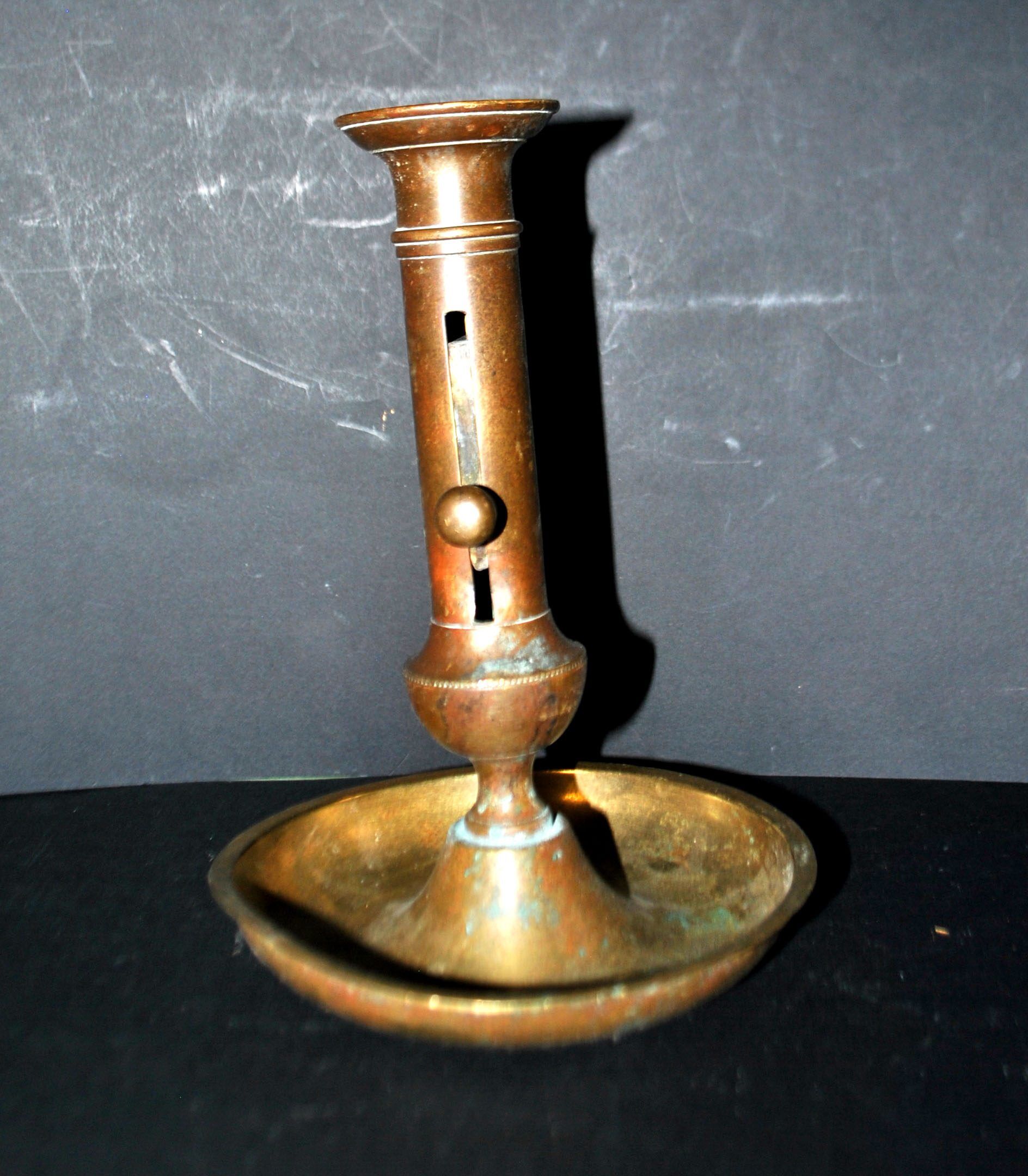 Antique push candle holder, 18th century gilded carved bronze candlestick.