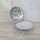 Scallop shell butter dish in stainless steel with its white glass saucer.