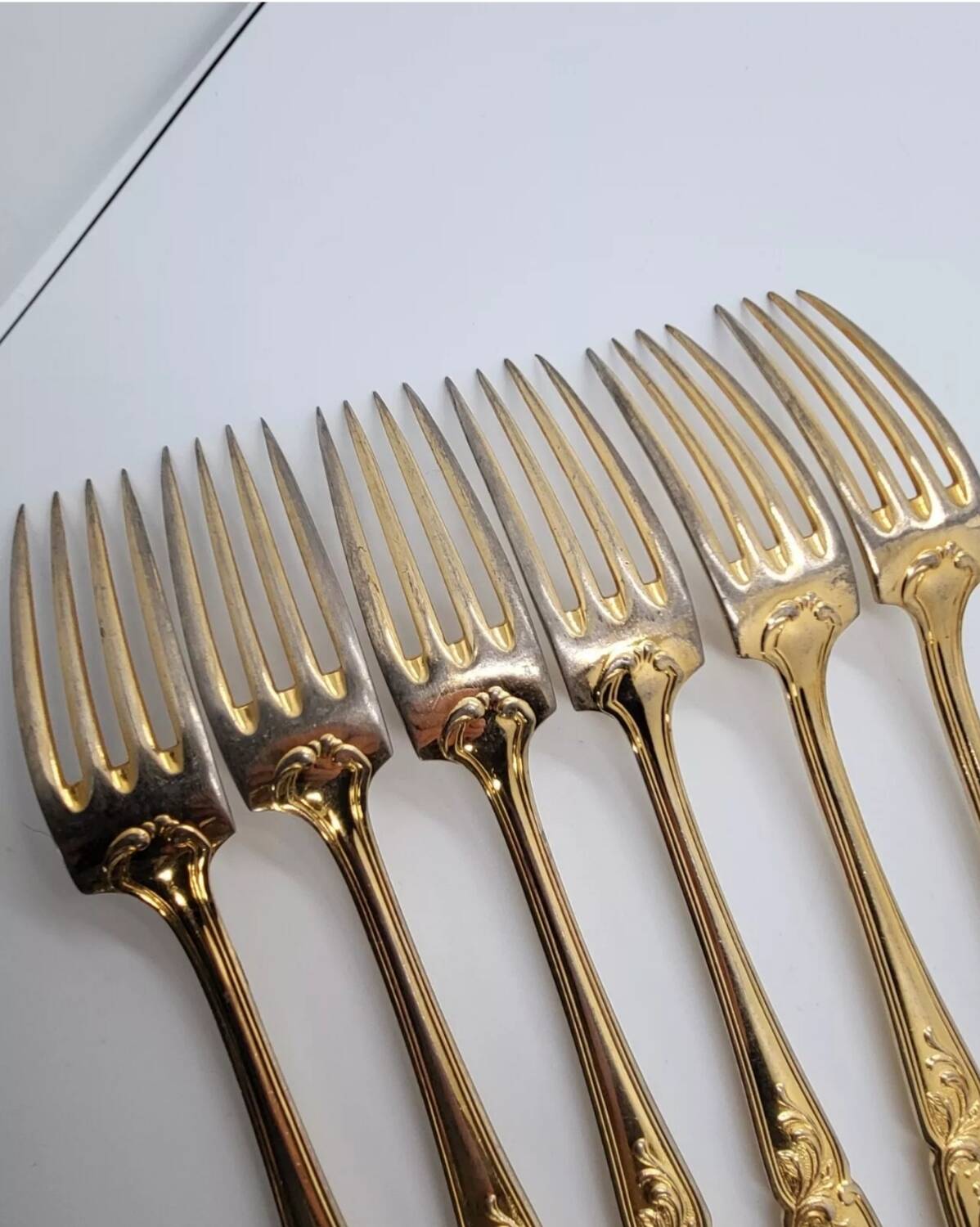 12 Table Forks in gold metal