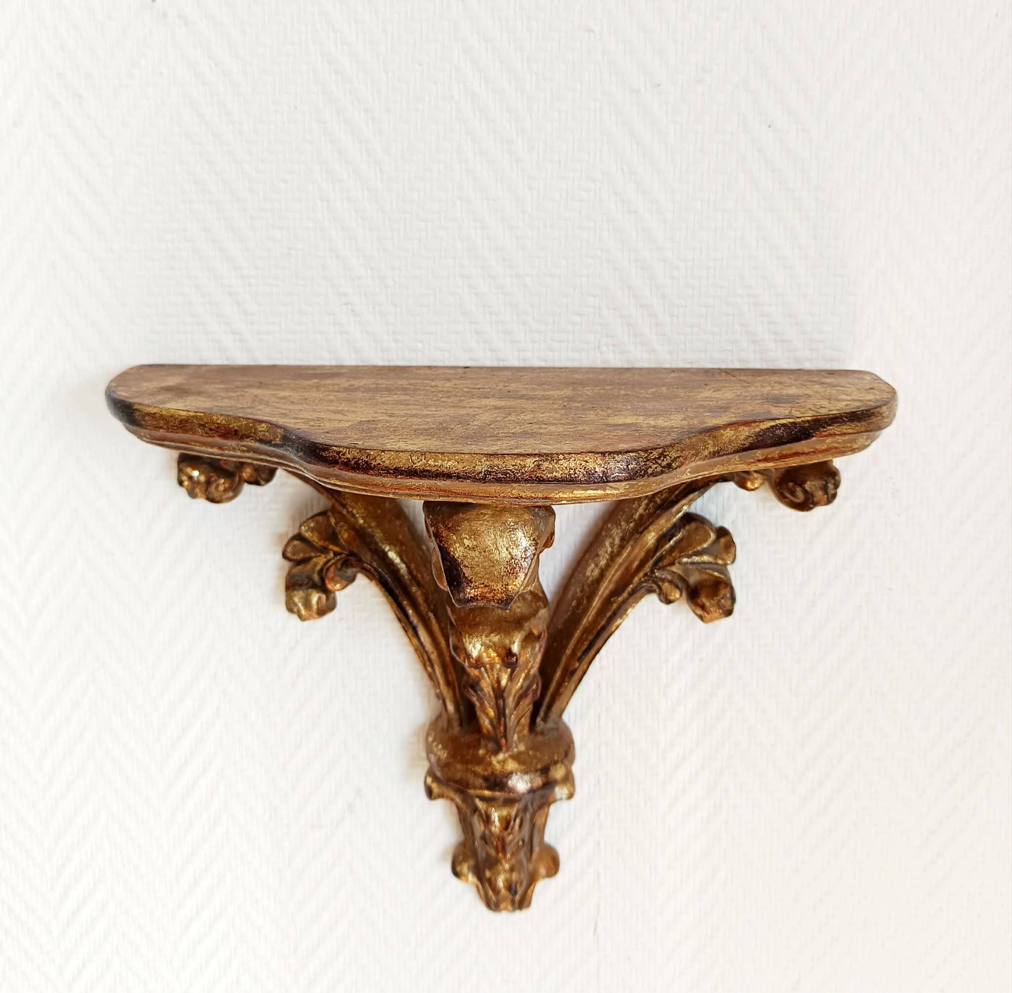 Golden wood wall console in Louis XV style.