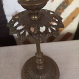 Old candlestick with chiseled bronze collar