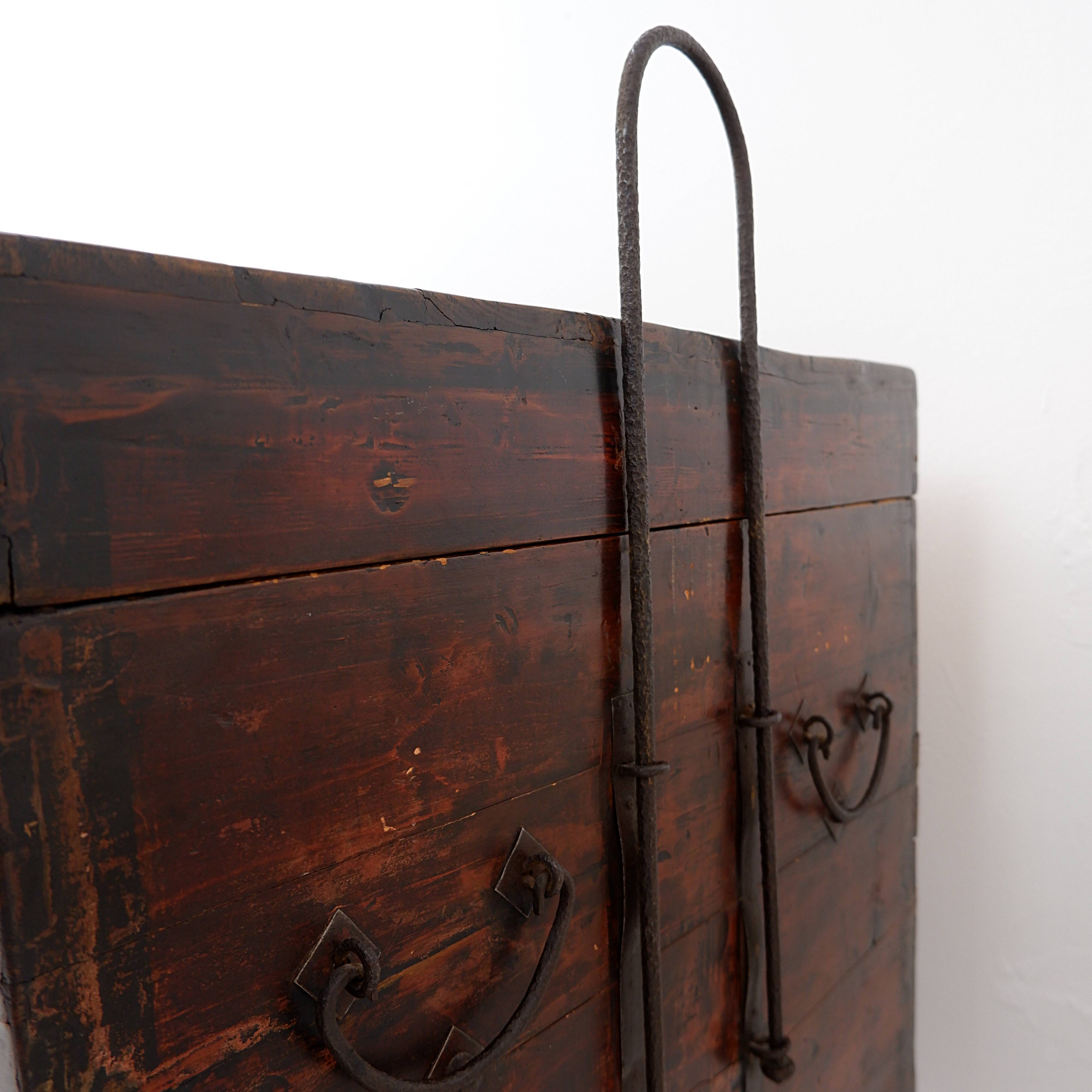 Ancient Japanese chest made of wood and iron.