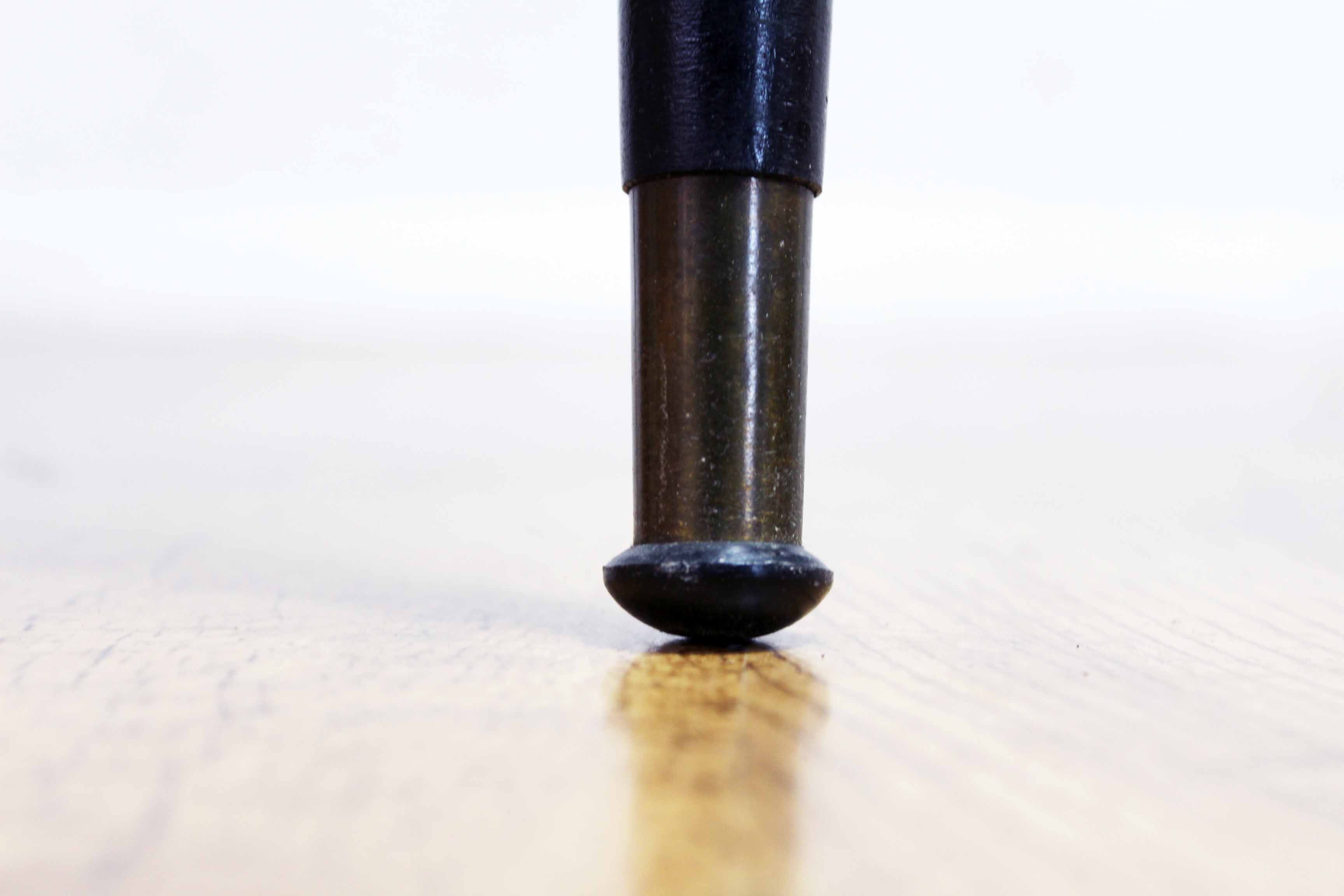 Low table with compass feet with decorative cabinet