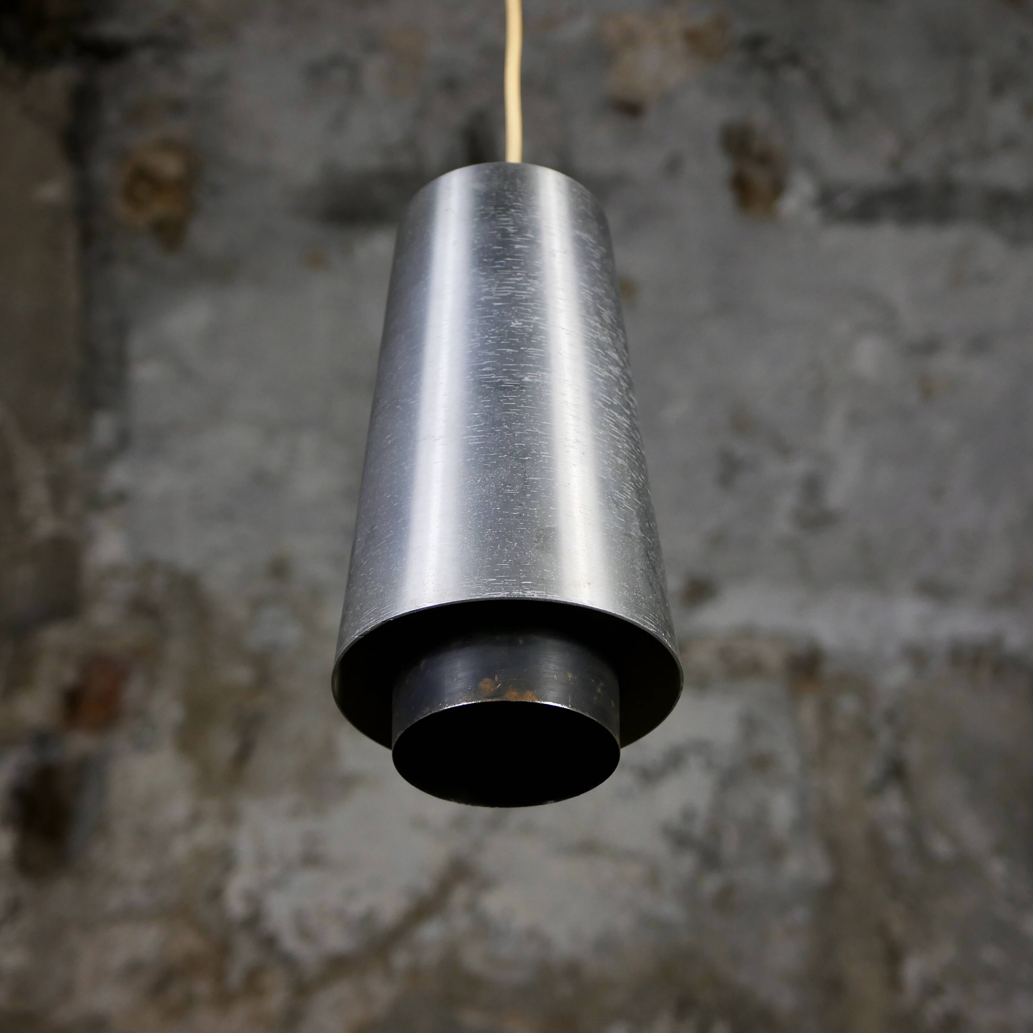 Trio of Raak steel pendant lights, 1960s