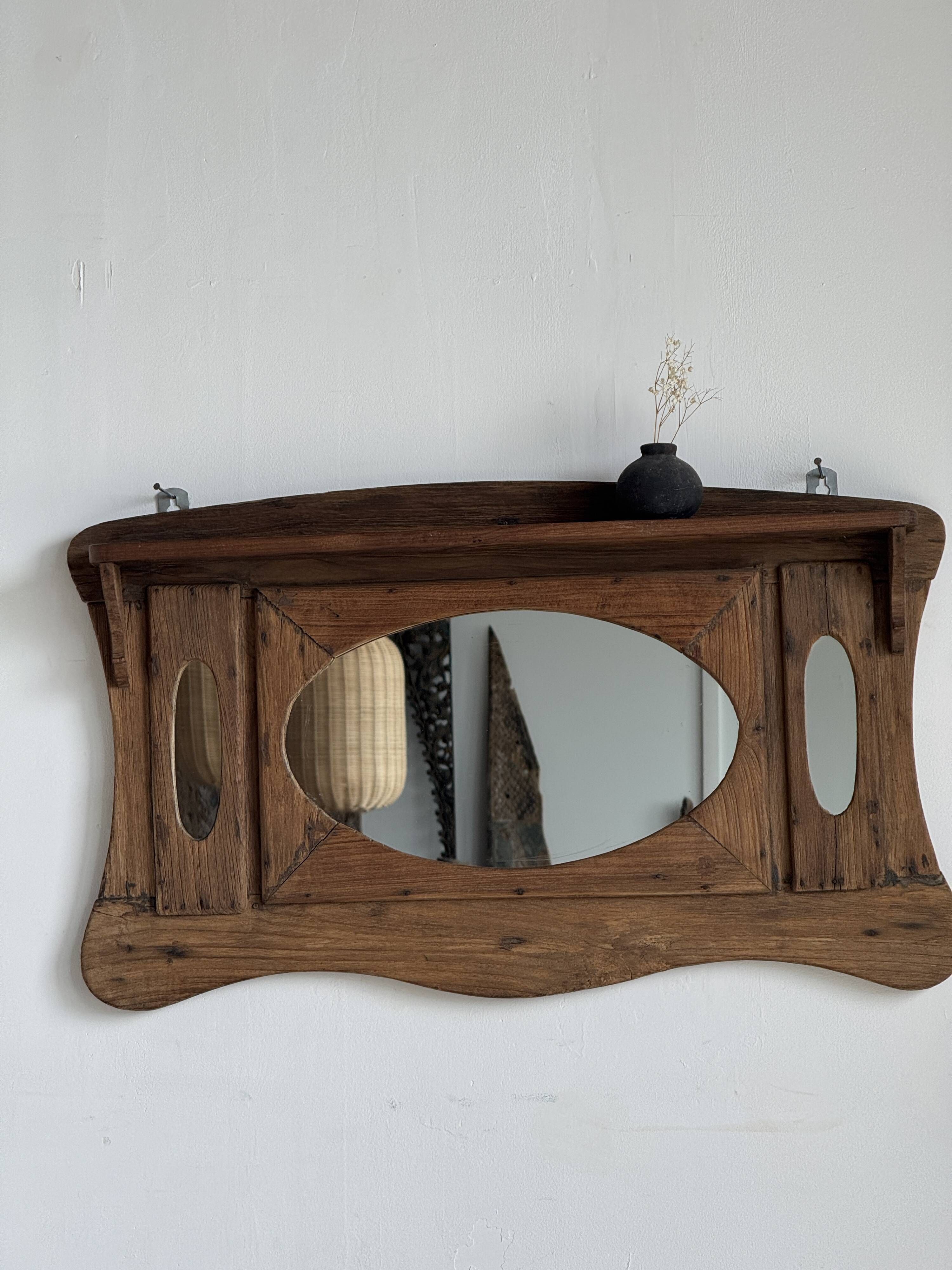 Small wall mirror in organic old Indonesian teak 75x45.