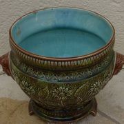 Old earthenware cachepot with woman decoration