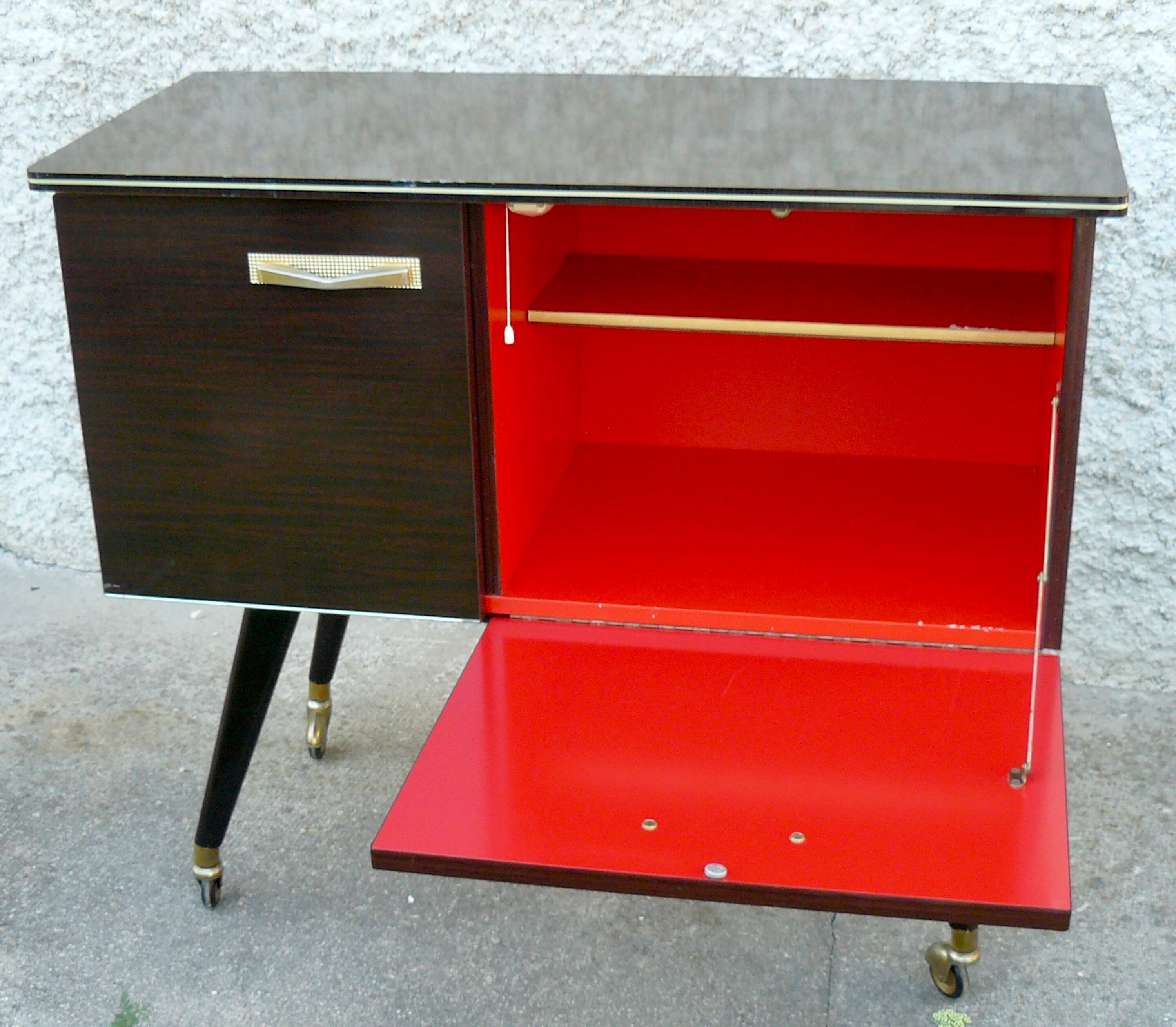 Vintage 1960s rolling and lighting bar with compass legs