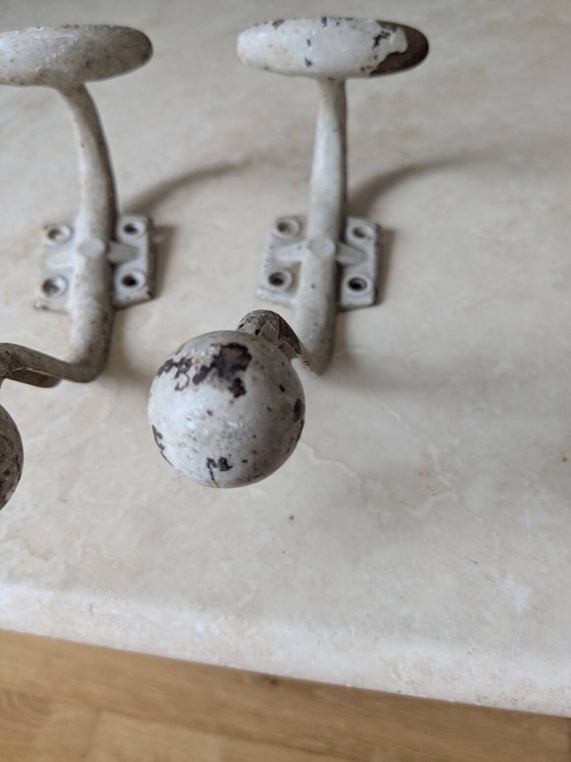Two vintage coat hooks