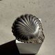 Large antique silver-plated bowl in the shape of a shell.