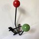 Small double coat hook in metal and wood painted green and red, 1950s-60s