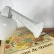 Swan neck wall light in ceramic with an opaline white glass globe.