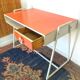 Bureau et sa chaise vintage en formica orange
