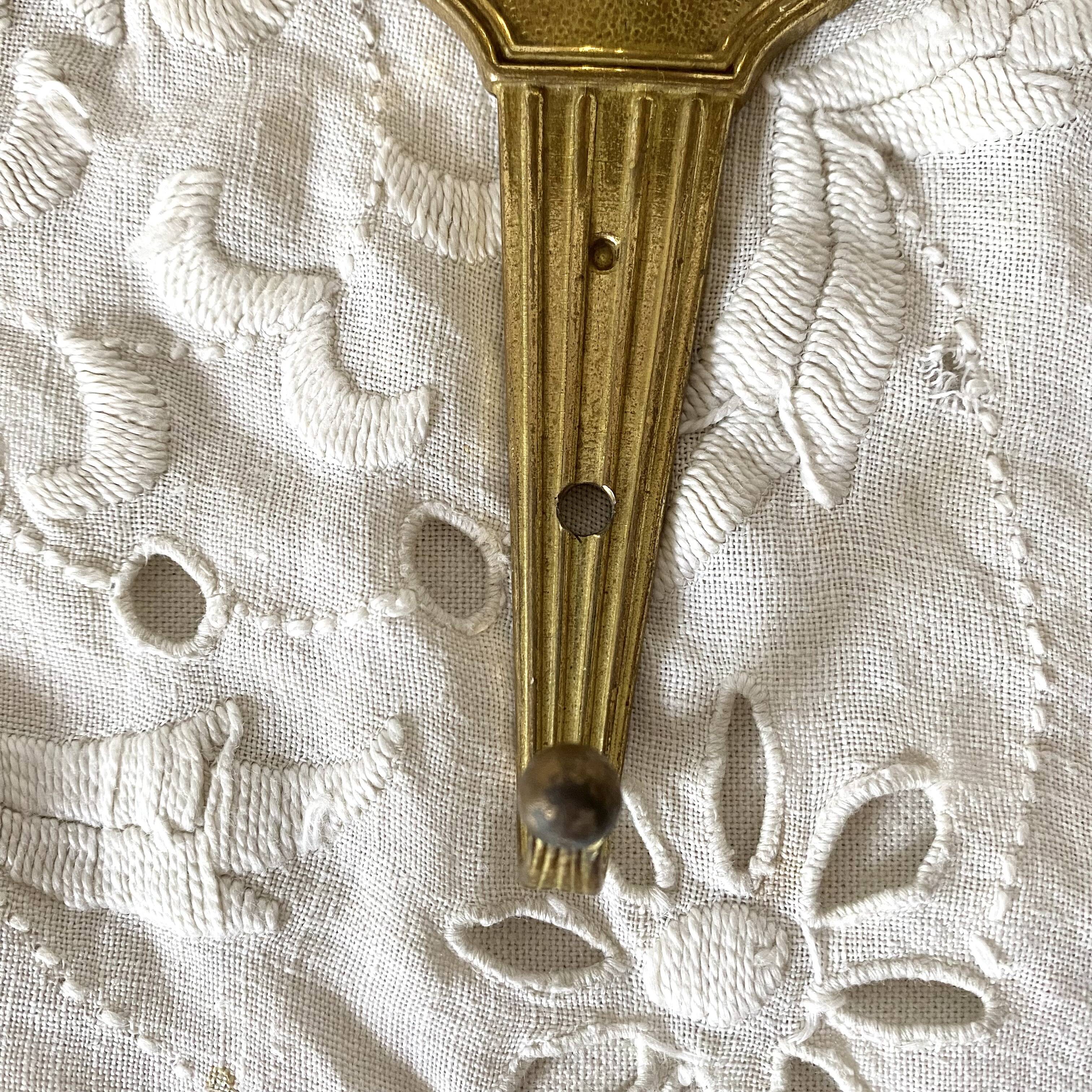 Golden brass coat hook