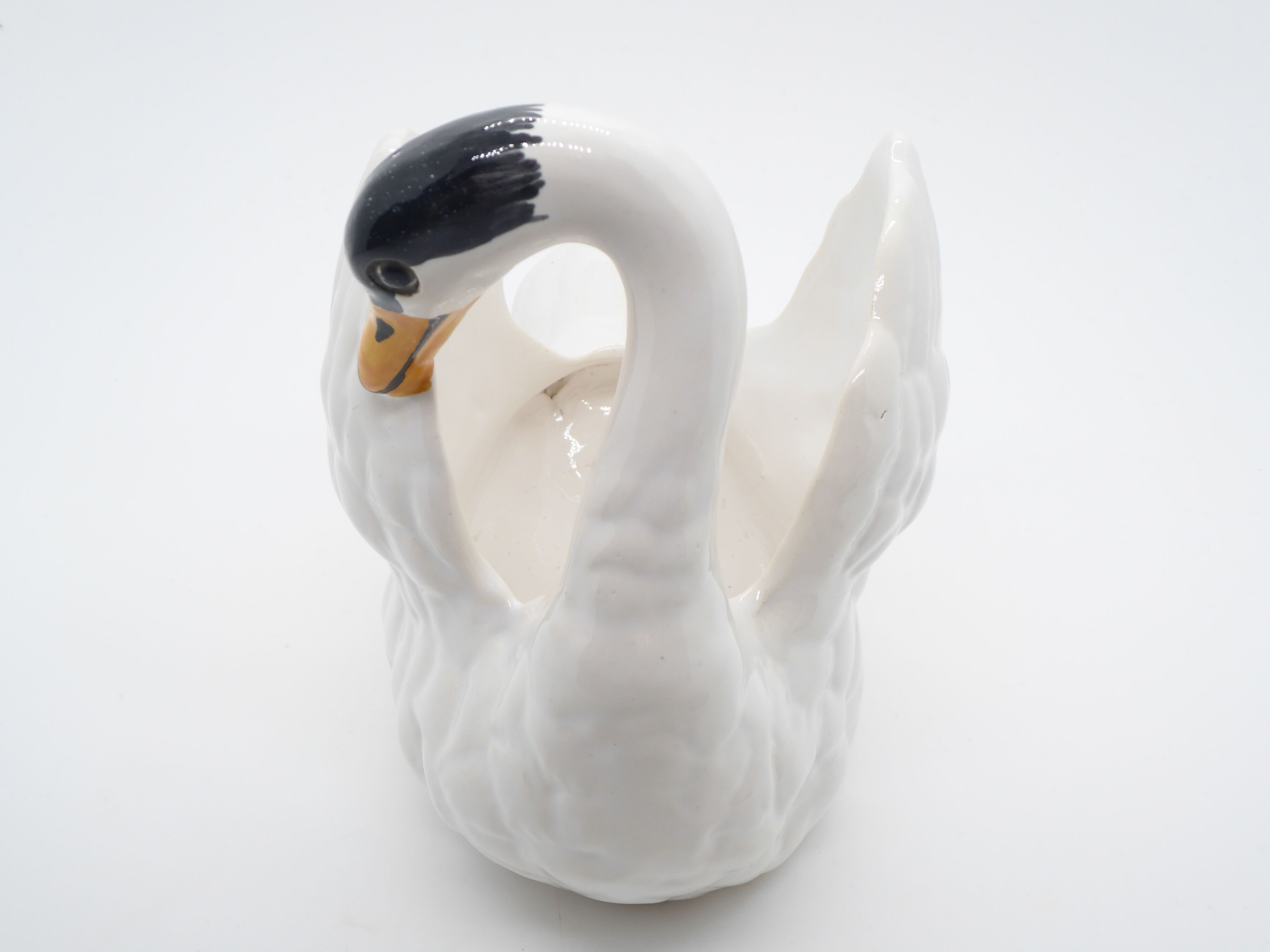 Ceramic pot cover in the shape of a swan