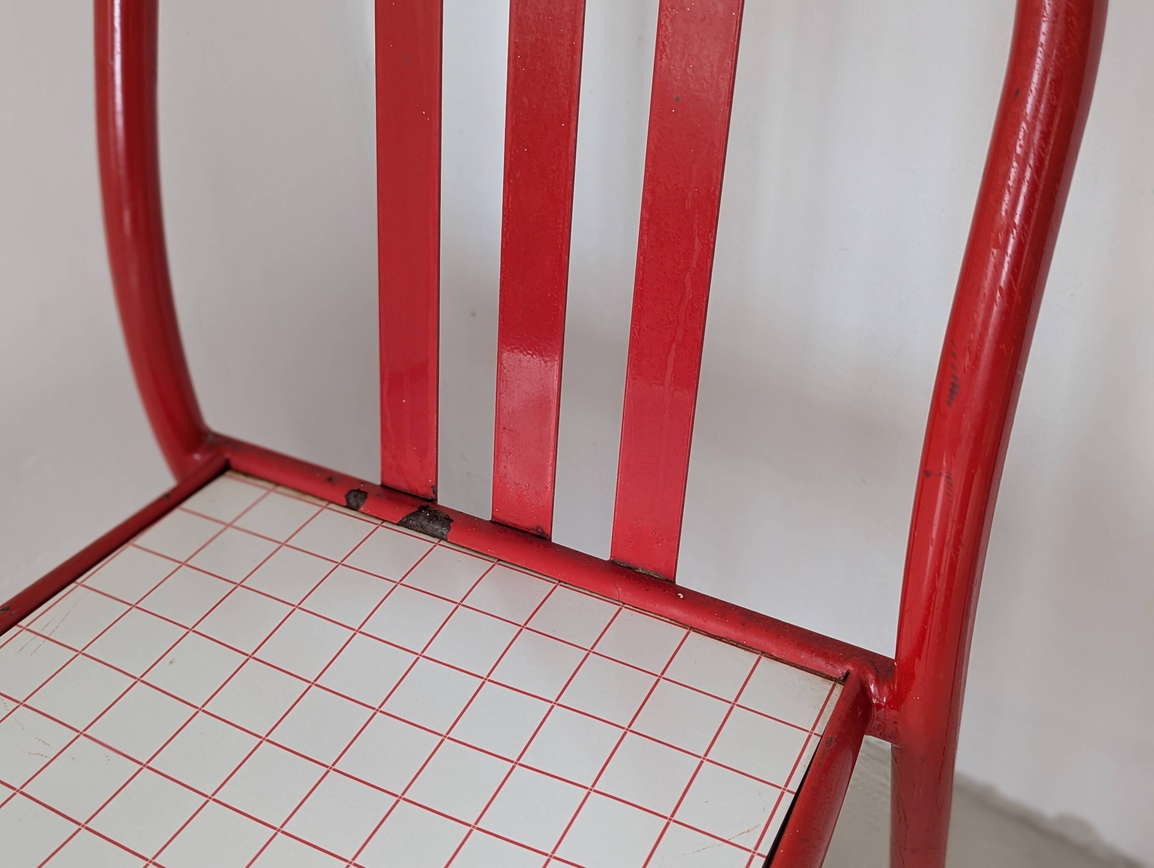 Set of 4 modernist red metal chairs