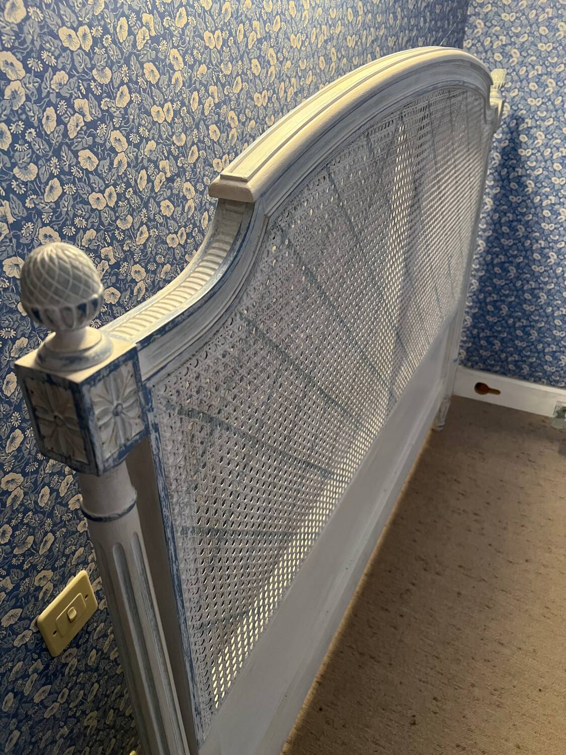 White wooden cane bed