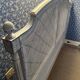 White wooden cane bed