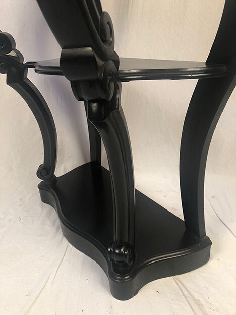 Pair of blackened wooden consoles, marble top