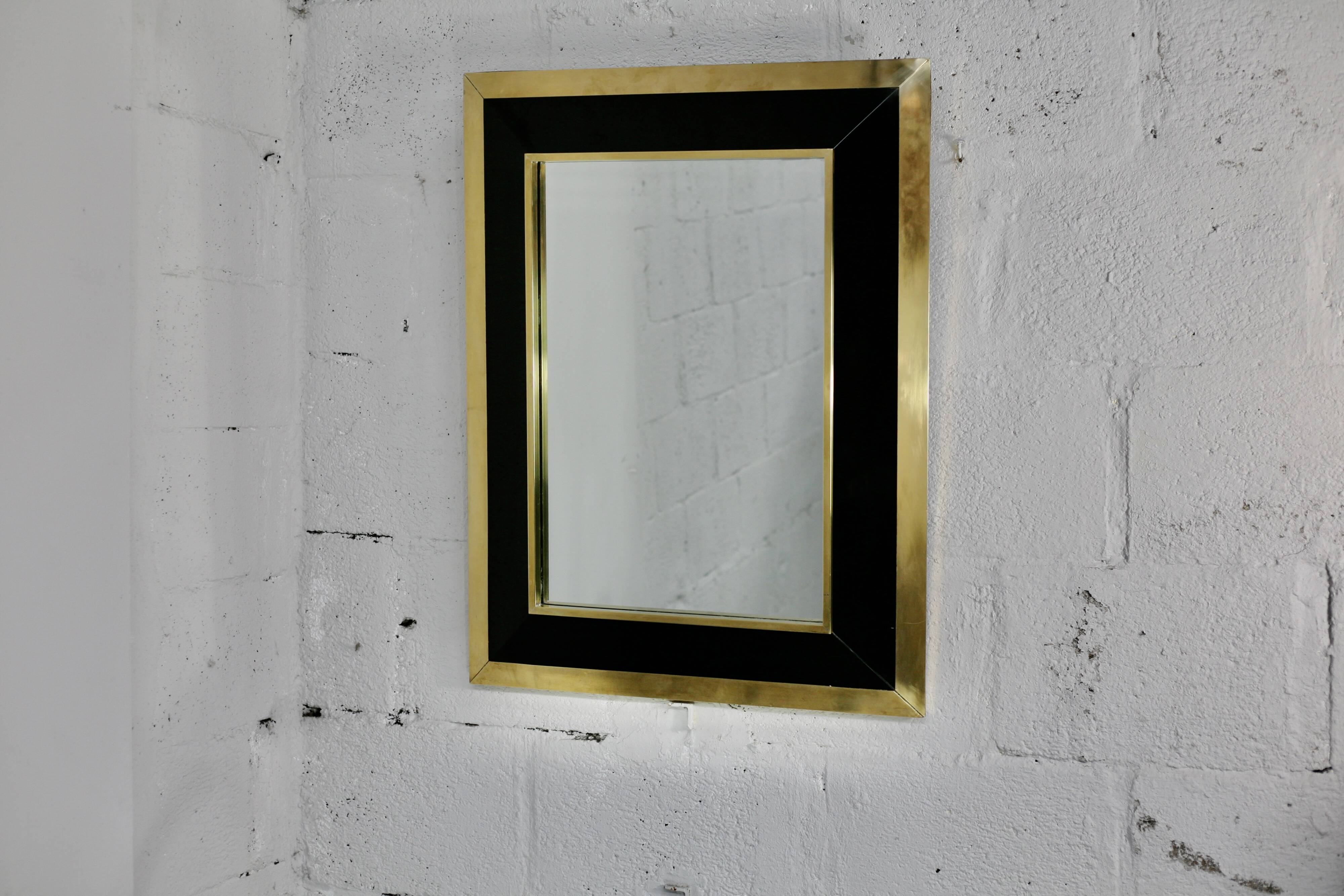 Jean-Claude Mahey mirror. Black lacquered wood and gold metal. 1970