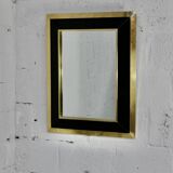 Jean-Claude Mahey mirror. Black lacquered wood and gold metal. 1970