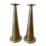 Pair of hammered metal candlesticks