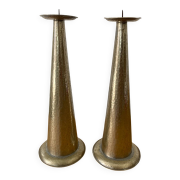Pair of hammered metal candlesticks