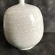 Vase boule à col pincé aplati