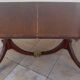 Mahogany top table inlaid with light wood nets and brass toes