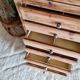Old wooden chest of drawers raw and black wood