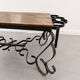 Antique solid wood coffee table with integrated wine rack.