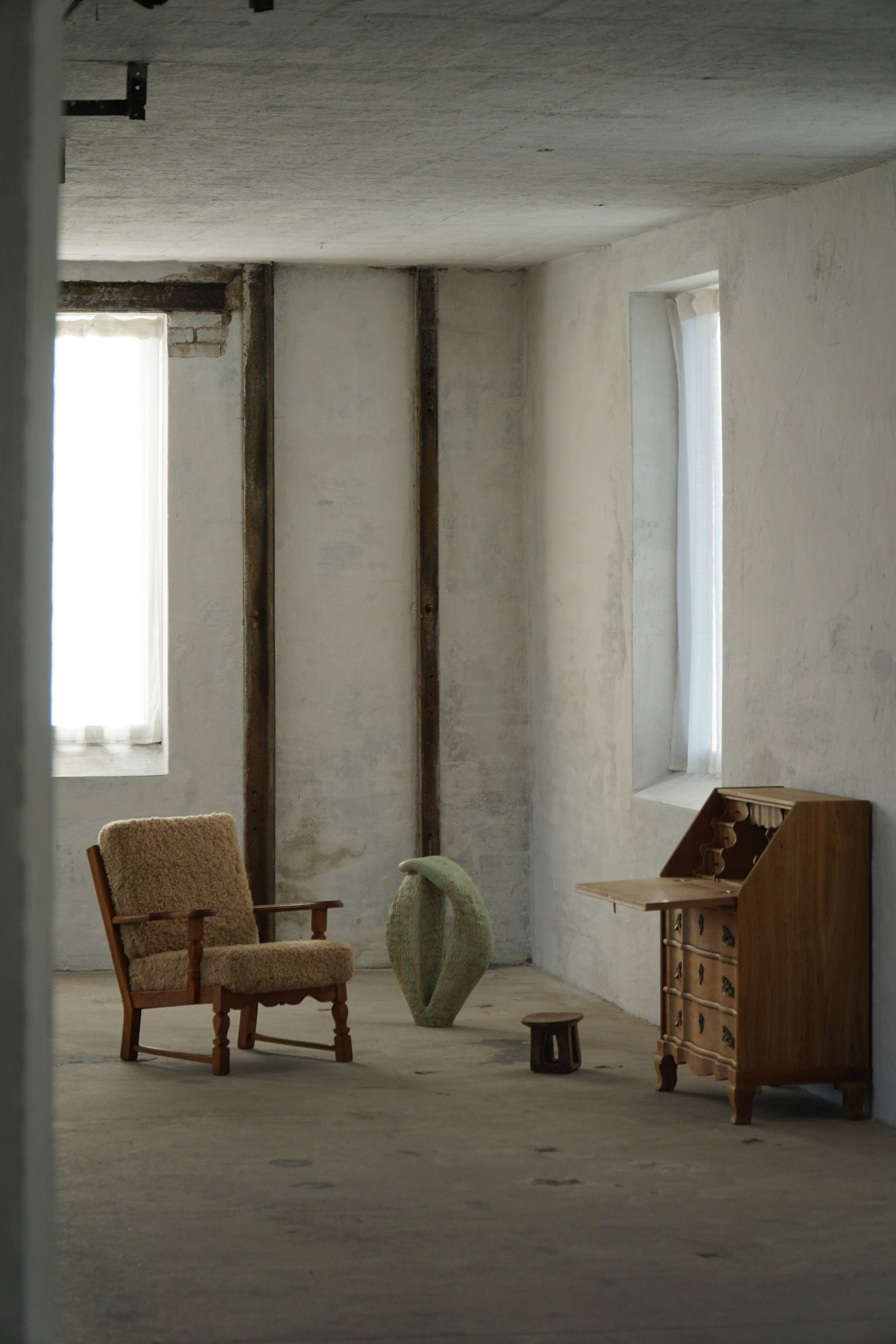 Danish modernist lounge chair in oak and lambswool, Henning Kjærnulf, 1960s