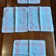 4 embroidered napkins on thread, tea service. Pink trim. Initials M.P.