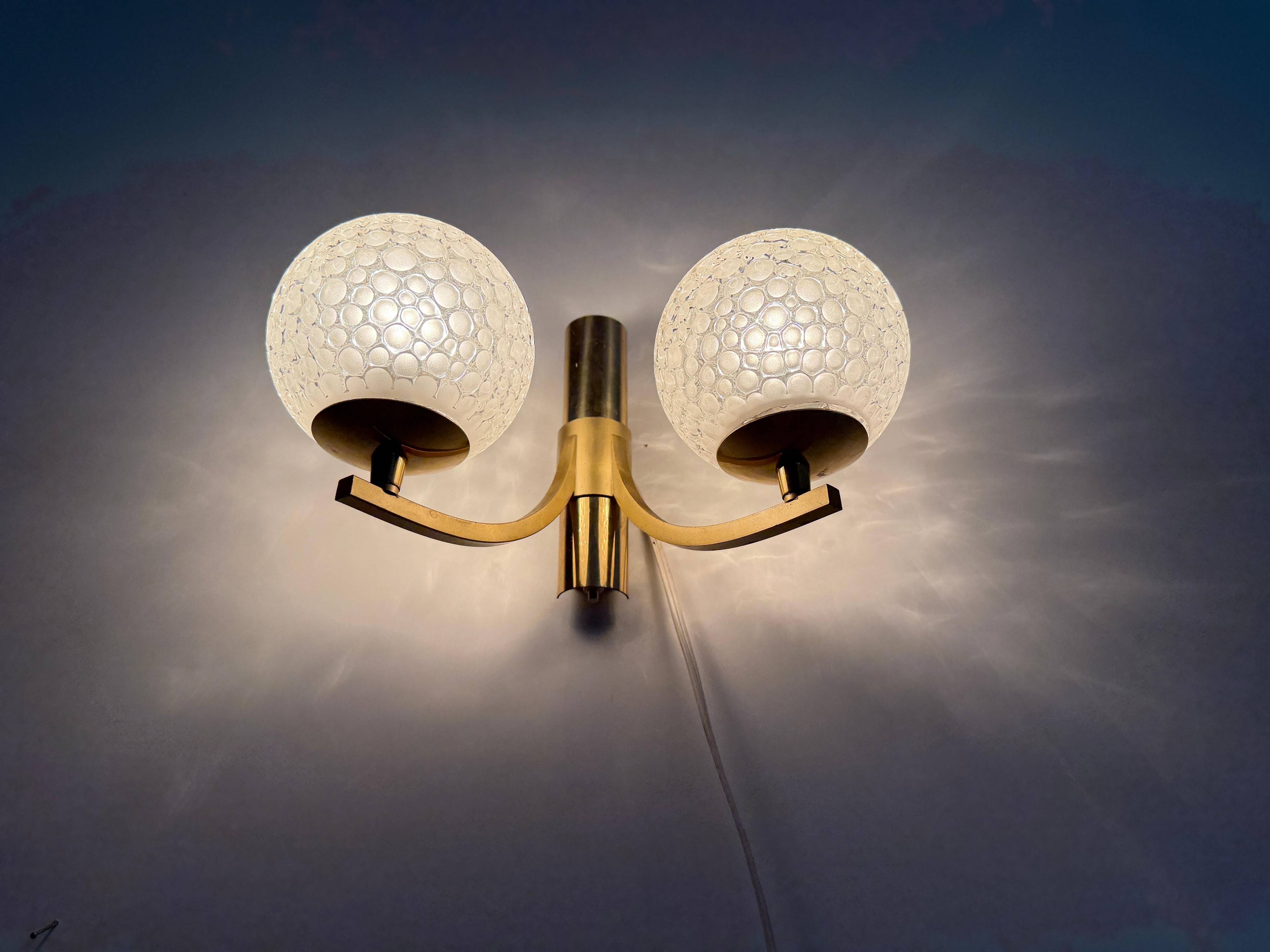 Simple two-armed wall light in brass and glass by Ball and Ball, Kaiser, 1960s, Germany.