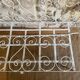 Small renovated wrought iron bed