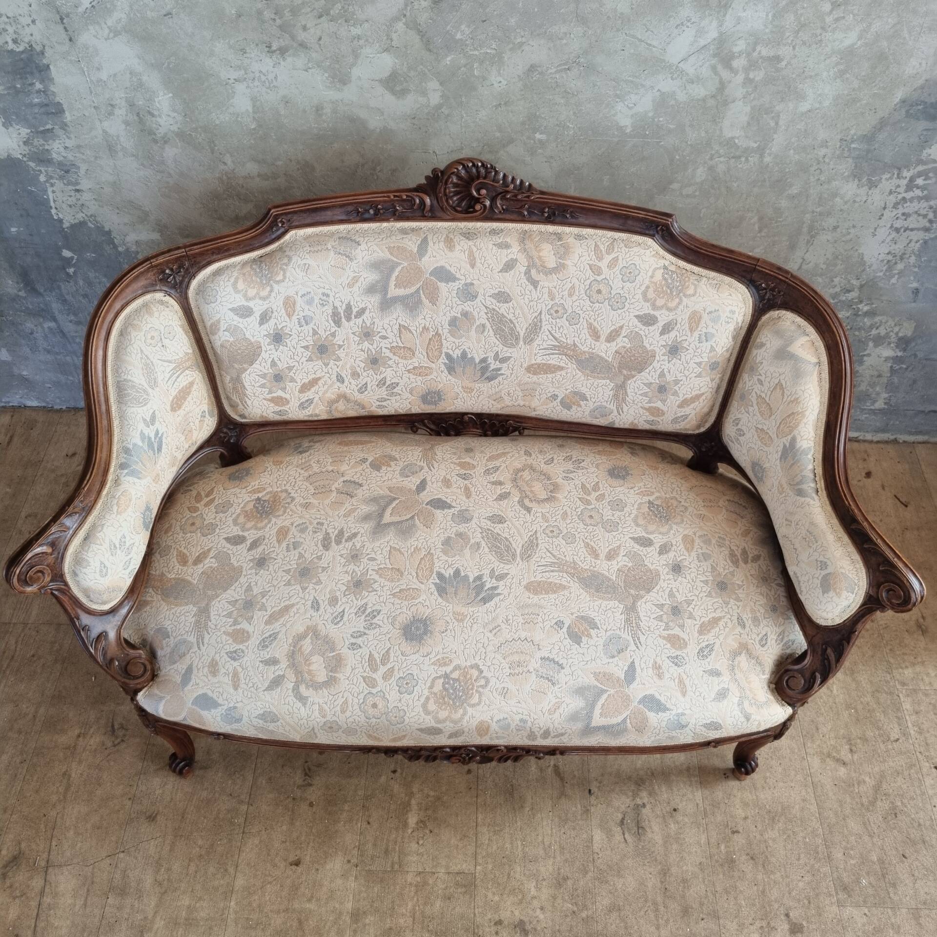 Small sofa or bench in Louis XV style, rococo.