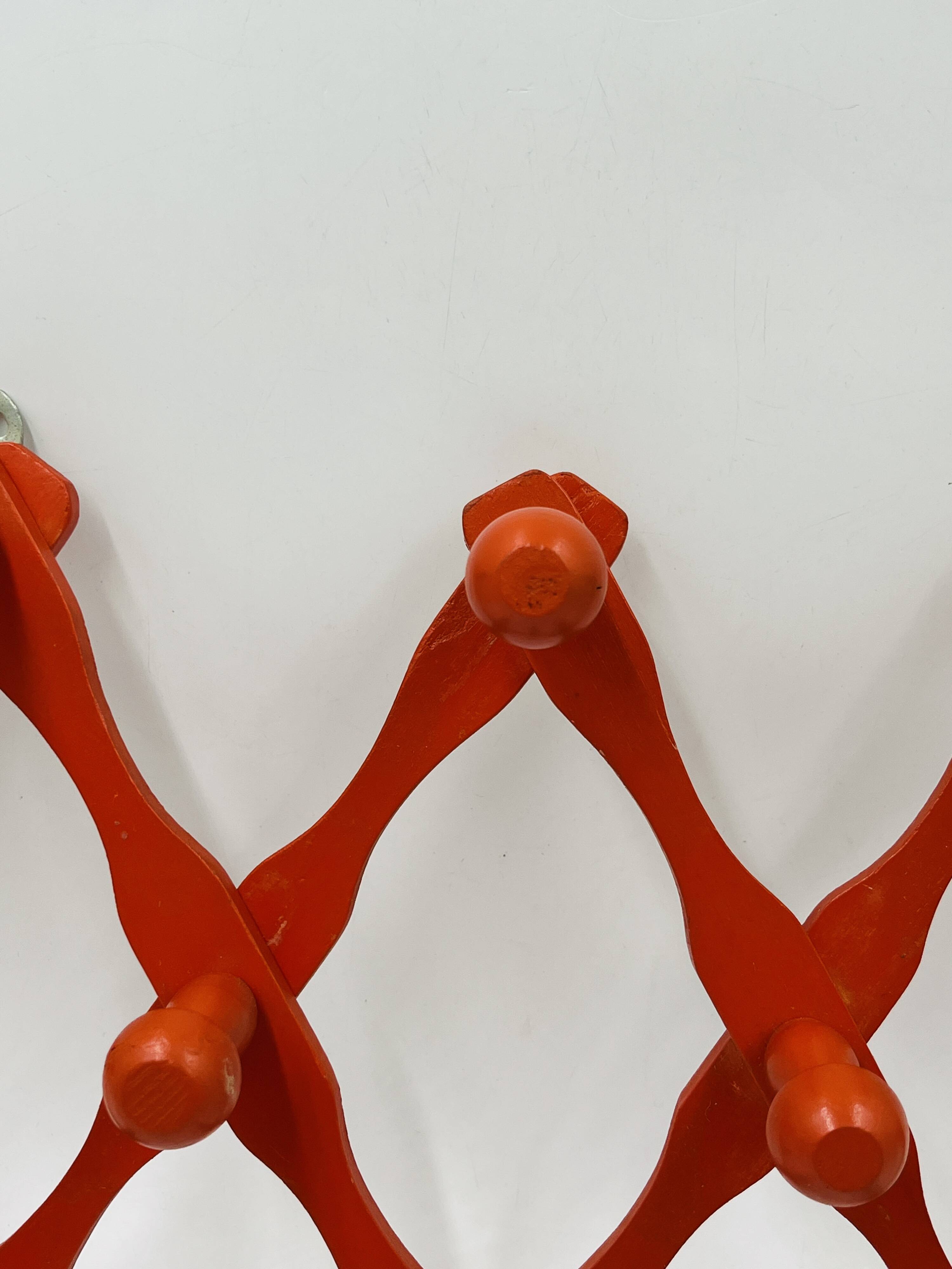 Vintage orange accordion coat rack
