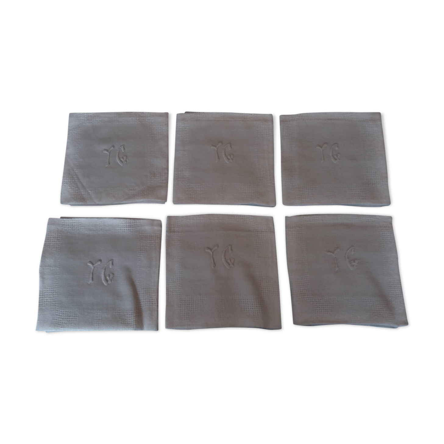 Series of six hand embroidered YG monogrammed YG linen table towels
