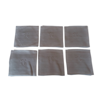 Series of six hand embroidered YG monogrammed YG linen table towels