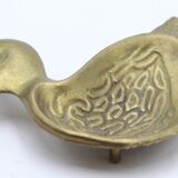 Empty brass duck pocket